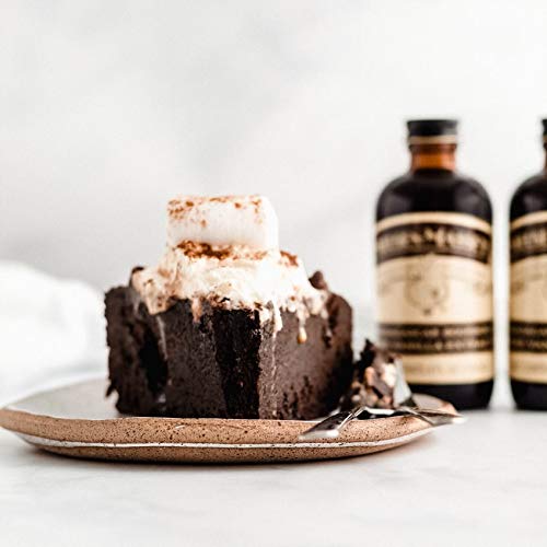 Nielsen-Massey bottle staged with baked goods showing flavor-enhancing benefit