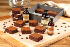 Nielsen‑Massey extract pouring into mixing bowl for concentrated flavor boost