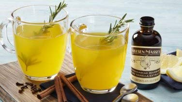 Nielsen-Massey pouring extract into bowl demonstrating smooth blending benefit