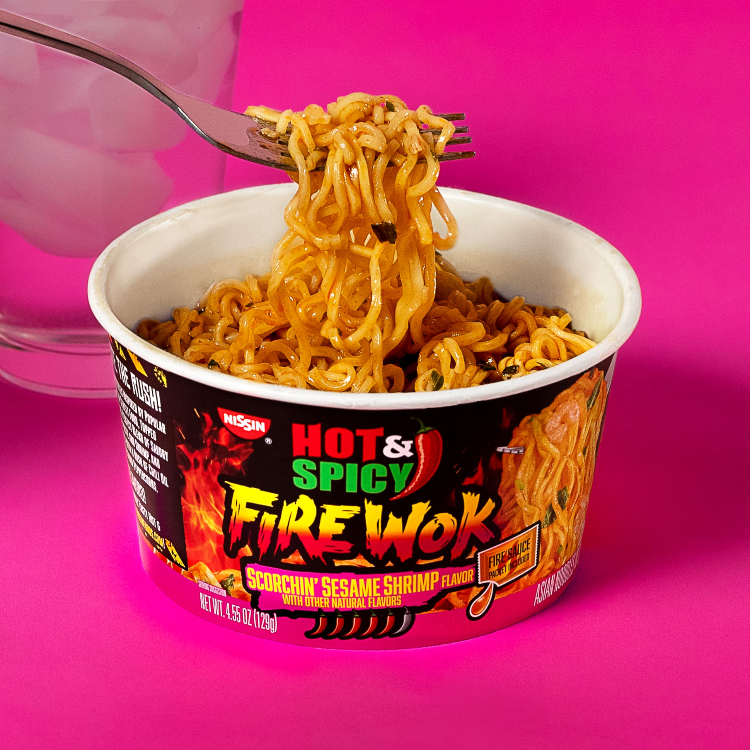 NISSIN fire sauce packet closeup, lets you control final spice intensity
