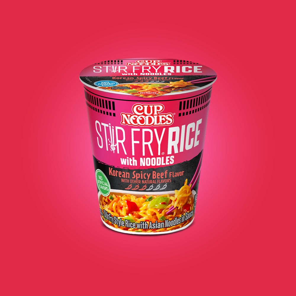NISSIN six-pack next to a ruler displaying single-serving size and value