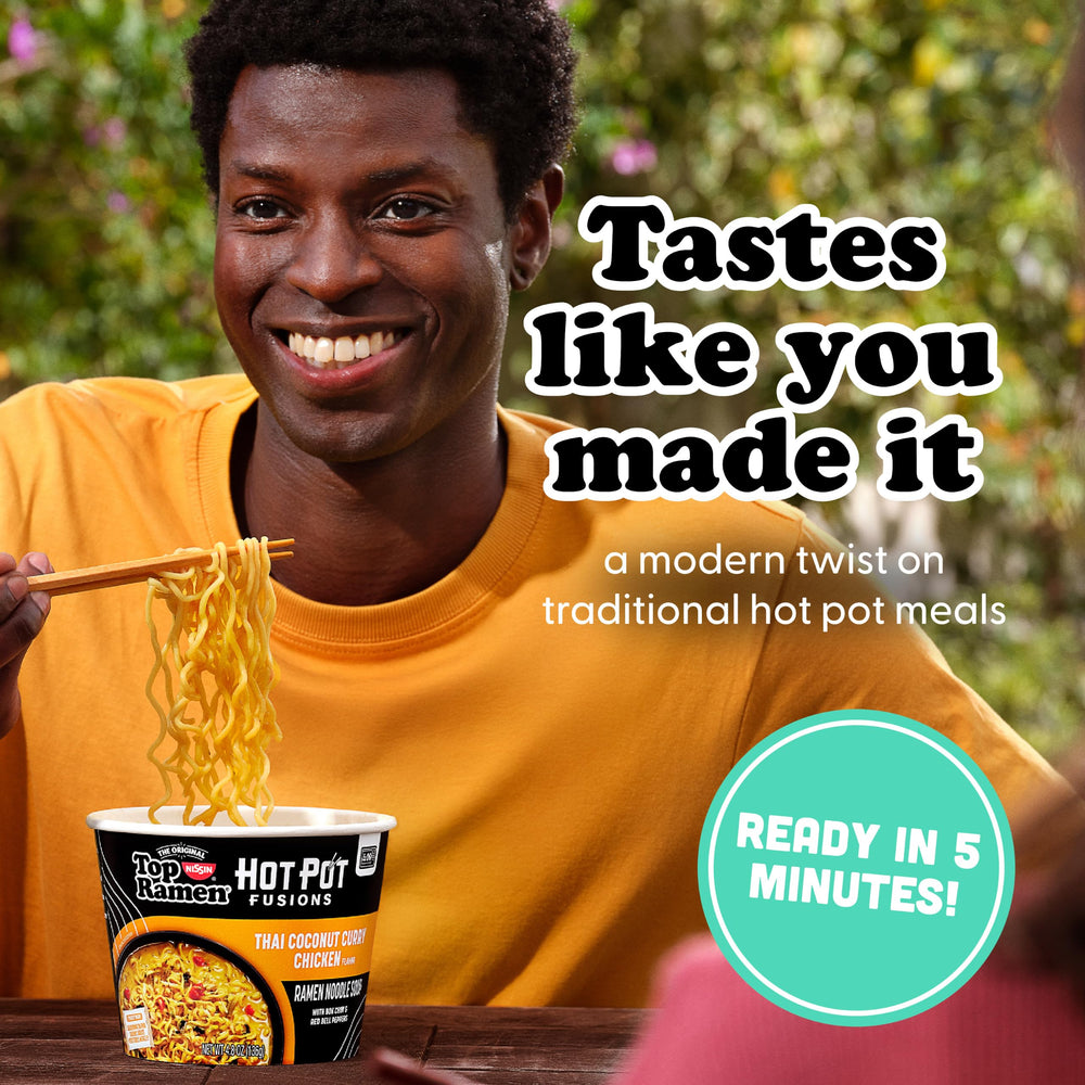 NISSIN Top Ramen close-up of noodles and creamy coconut curry broth, highlighting rich texture
