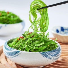 Noble Createaprototype seaweed salad served in bowl adding vibrant garnish