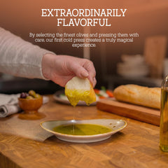 nonna's olive oil pour action over spoon, demonstrates smooth texture and controlled drizzle