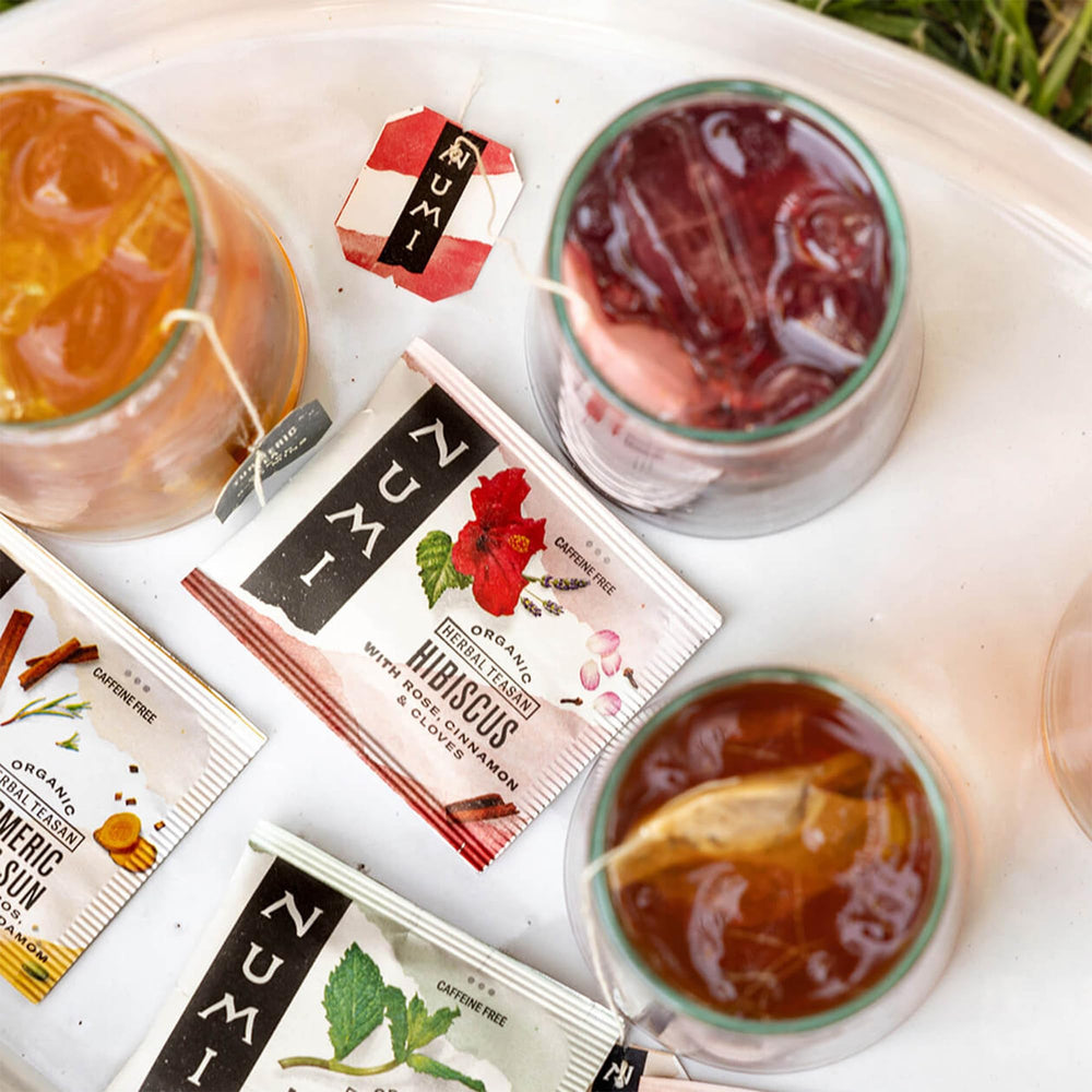 Numi brewed hibiscus tea poured over ice demonstrating bright color and refreshment