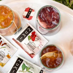 Numi brewed hibiscus tea poured over ice demonstrating bright color and refreshment