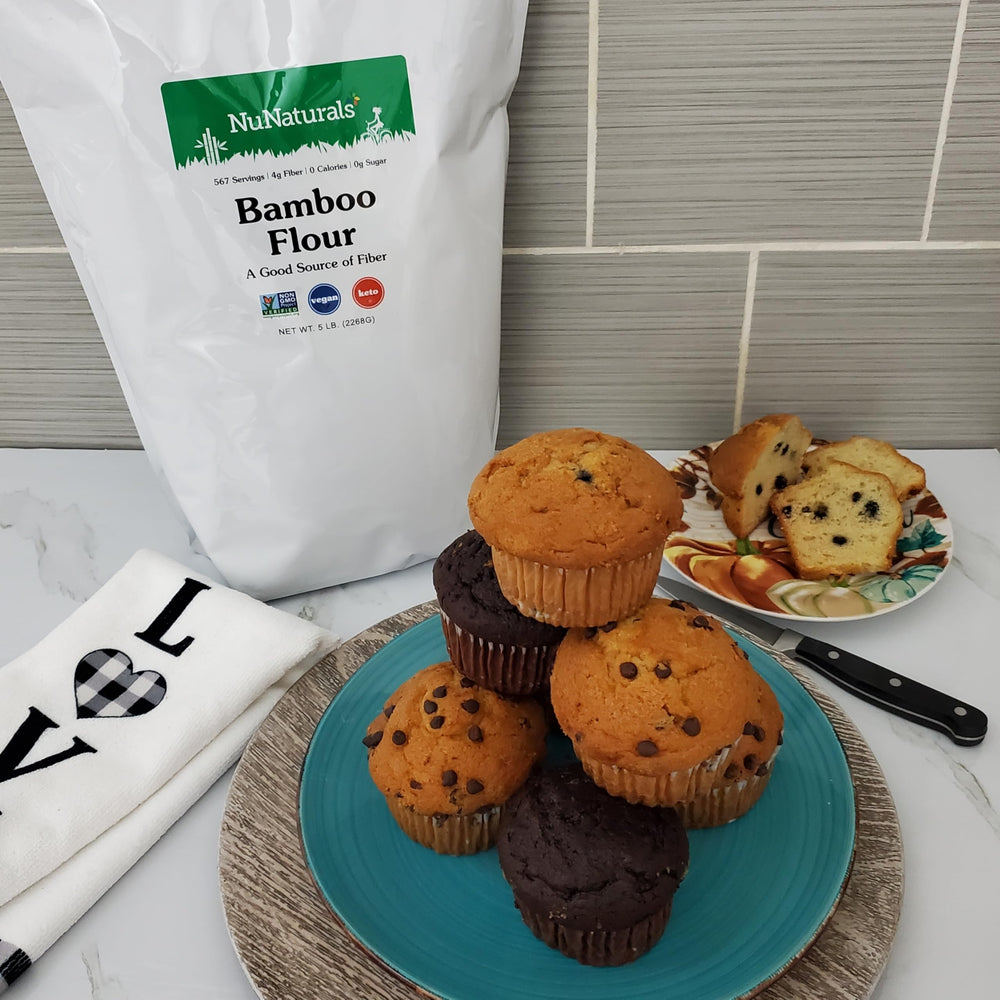 NuNaturals bamboo flour on scoop measuring tablespoons for precise recipe addition