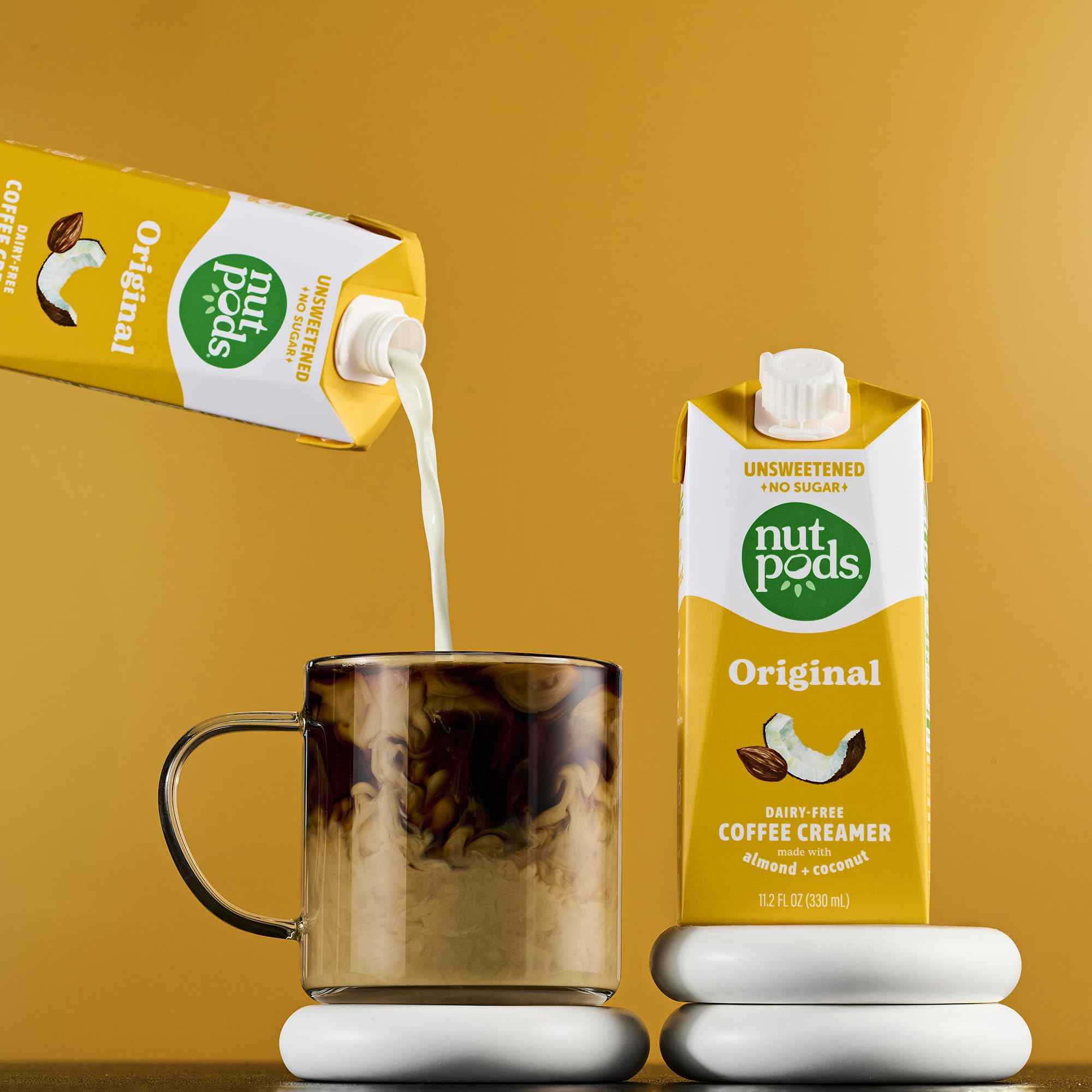 nutpods being poured into brewed coffee enhancing taste and creaminess