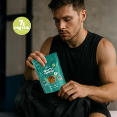 nutruit pouch next to a hand demonstrating single-serve size and easy grab-and-go benefit