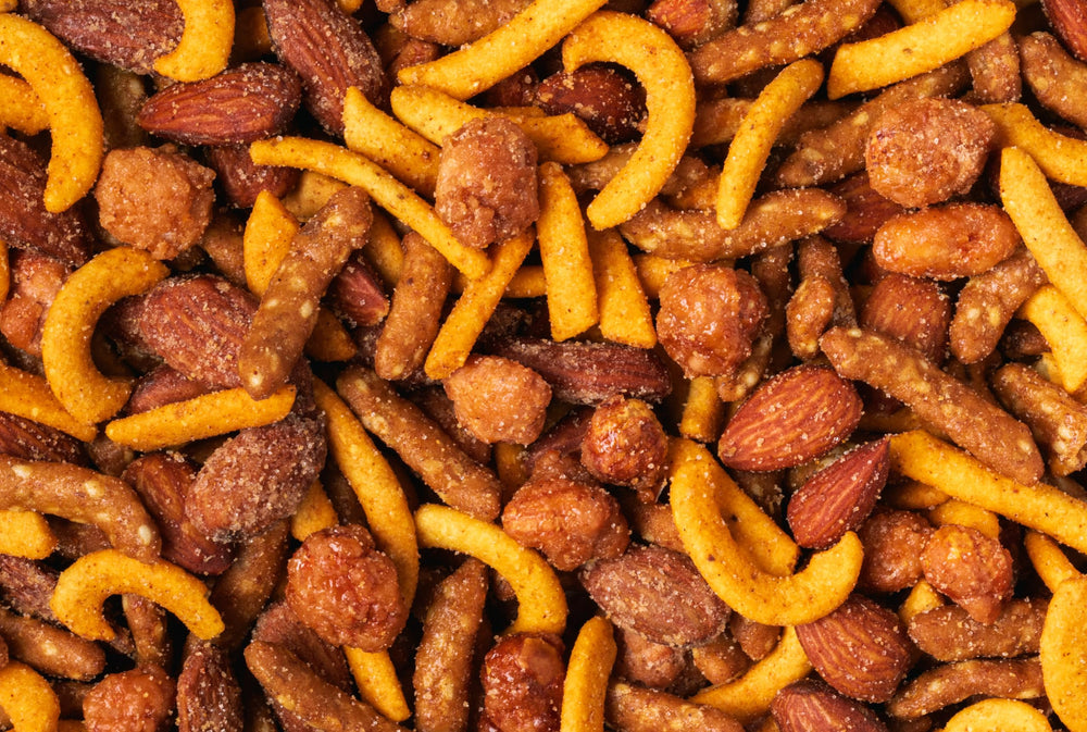 Nuts.com scattered trail mix on wood showing ingredient variety and appeal