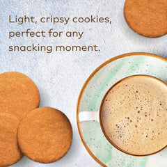 Nyakers cookies beside a coffee cup showing scale and serving suggestion