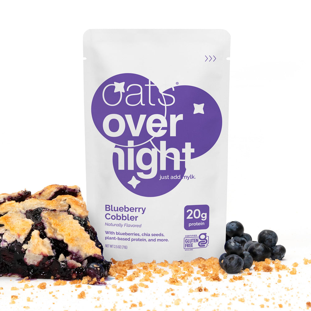 Oats Overnight pouch held in hand to show 2.5 oz size and portability