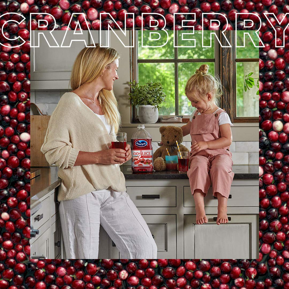 Ocean Spray bottle next to a measuring cup conveying 64 fl oz bottle scale and serving size