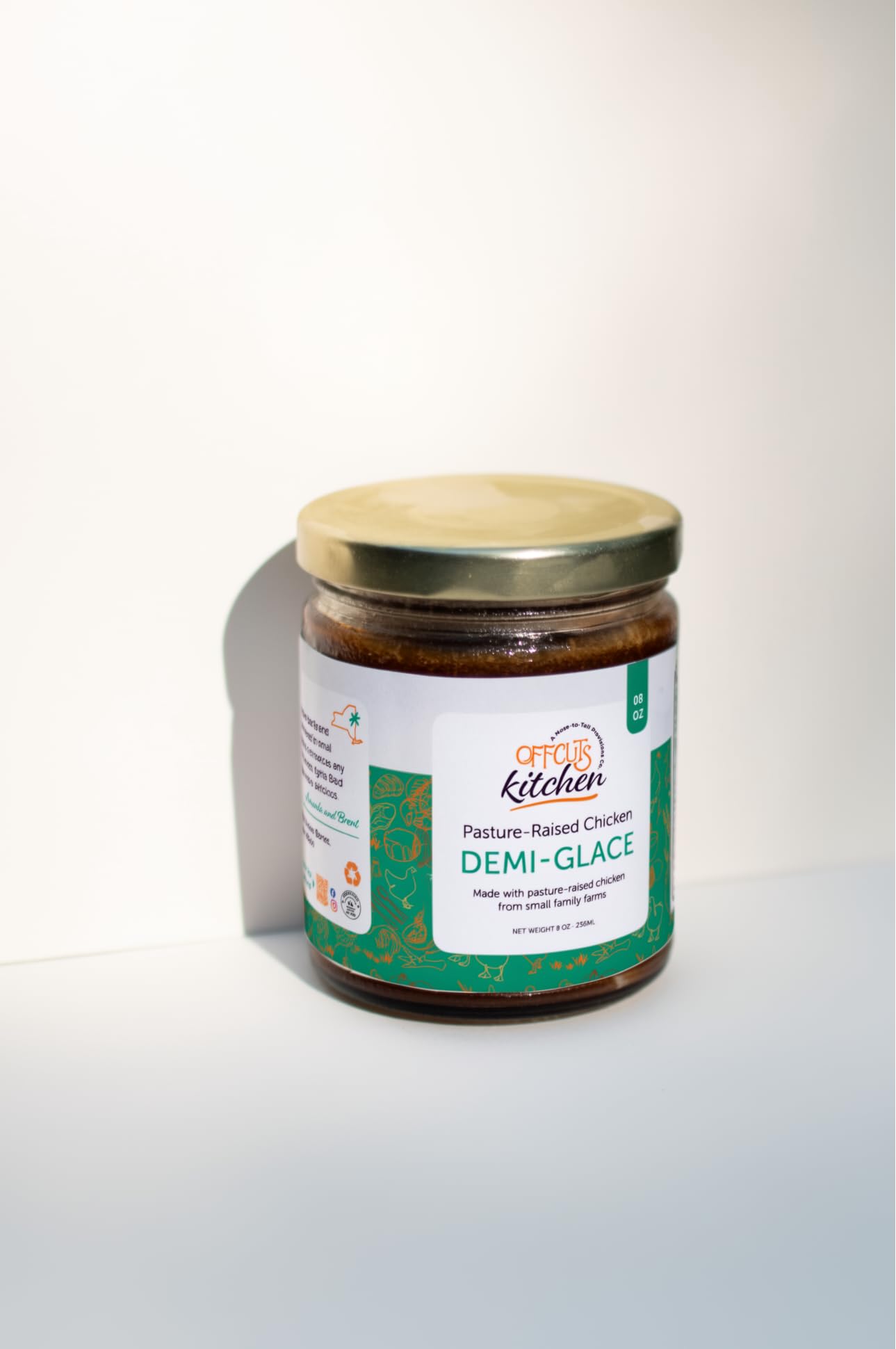 Offcuts Kitchen open jar showing glossy demi-glace surface highlighting rich collagen sheen