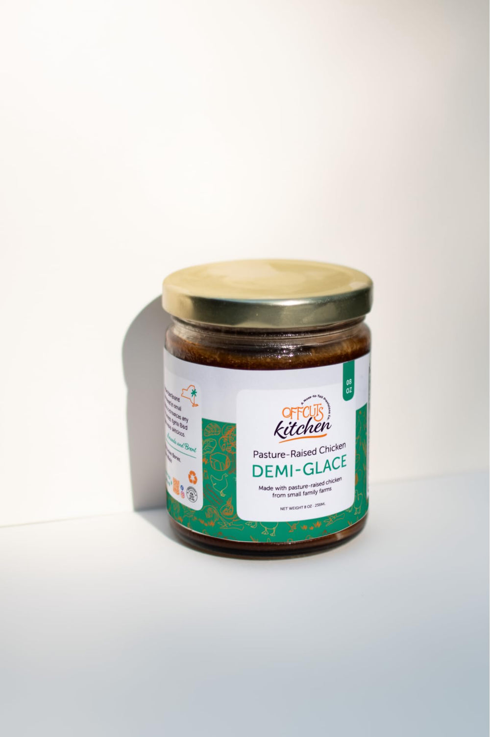 Offcuts Kitchen open jar showing glossy demi-glace surface highlighting rich collagen sheen