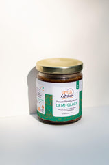 Offcuts Kitchen open jar showing glossy demi-glace surface highlighting rich collagen sheen