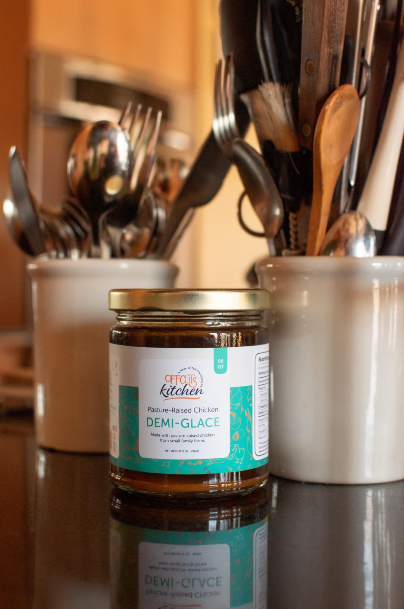 Offcuts Kitchen jar beside a spoon to show 8 oz scale and easy measuring convenience