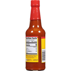 OLD BAY hot sauce bottle in kitchen beside seafood plate illustrating easy use