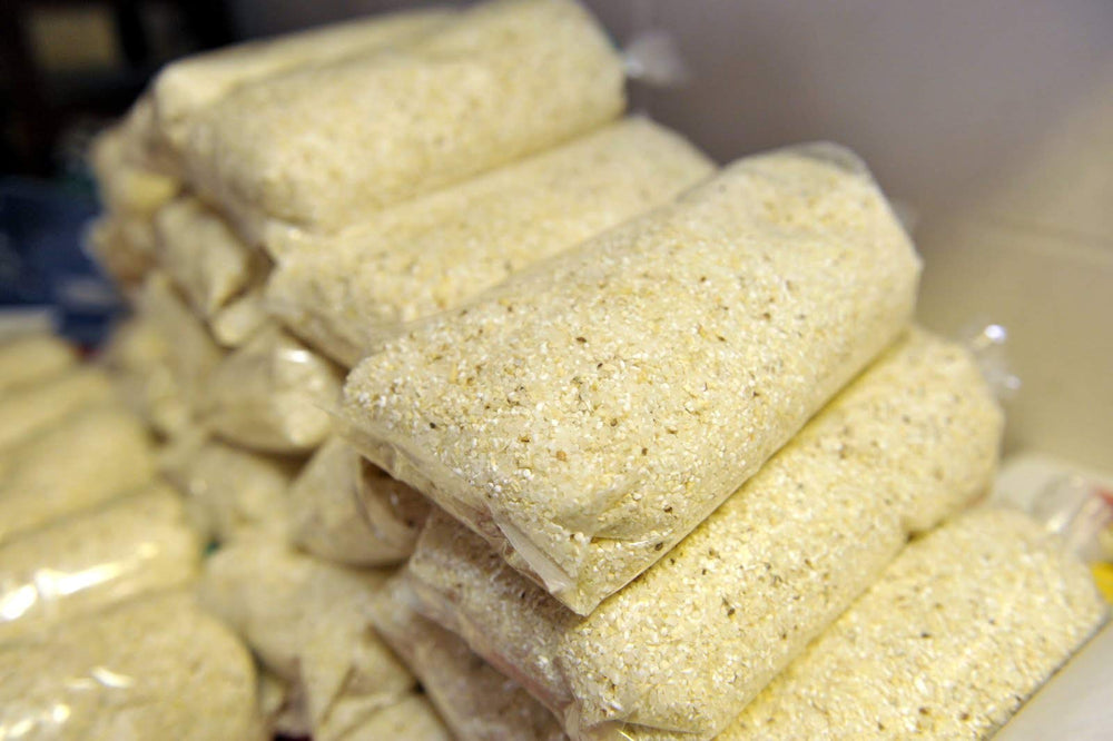 Old School Brand open bag with white corn kernels highlighting pure ingredients