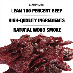 Old Trapper jerky in a hand outdoors showing portable snack benefit