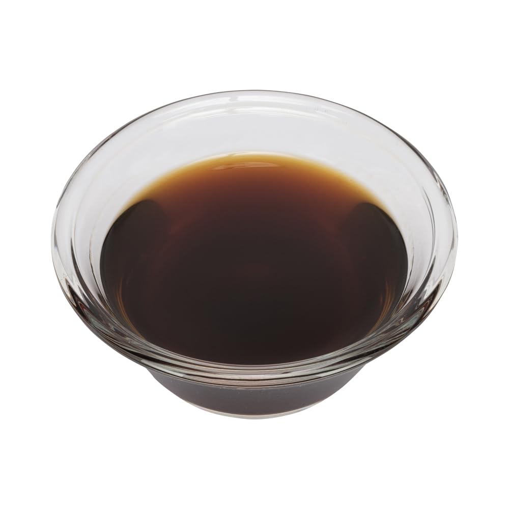 OLIVENATION black walnut dropper dispensing drops into batter to boost nutty flavor
