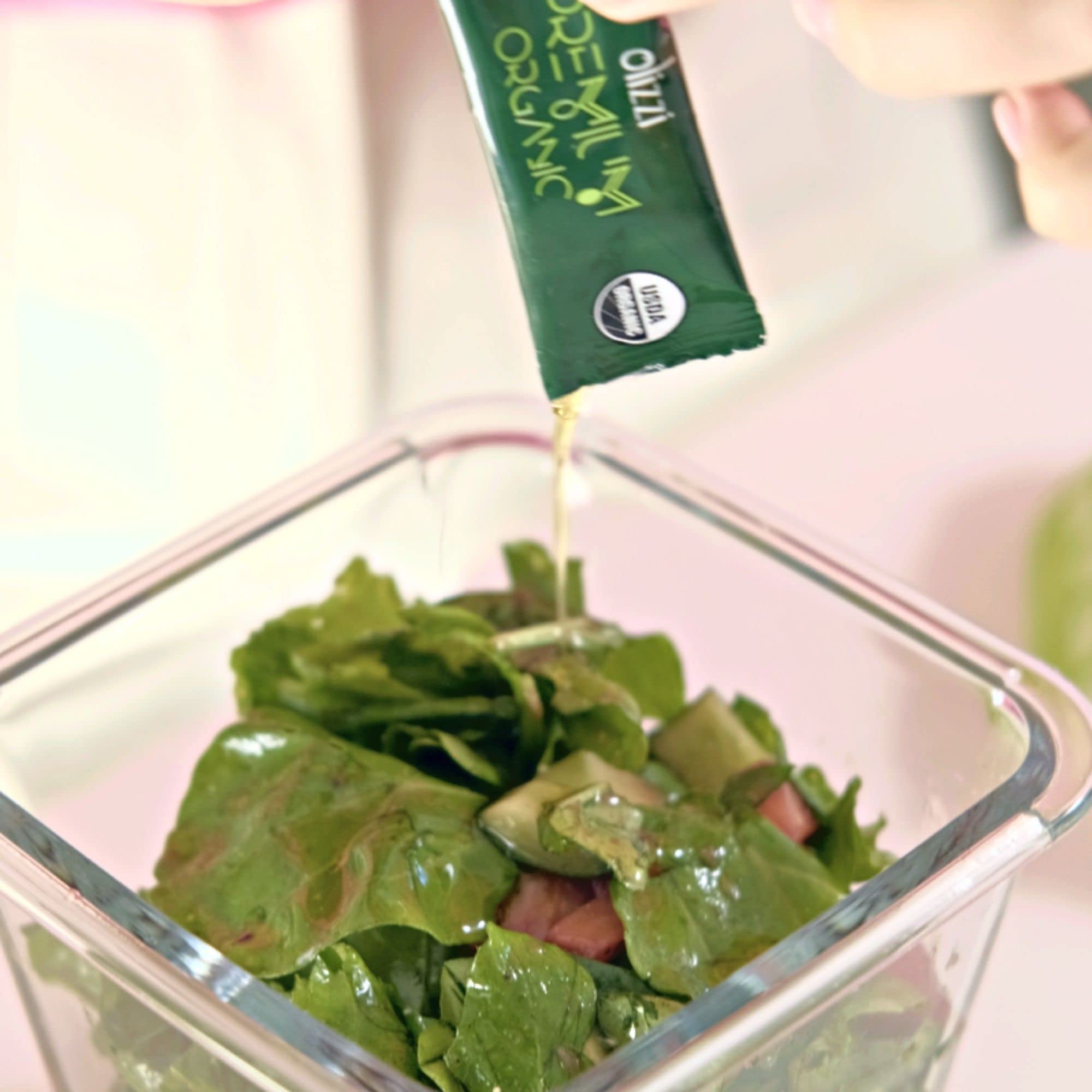 Olizzi label and certifications including USDA Organic and award badges for quality