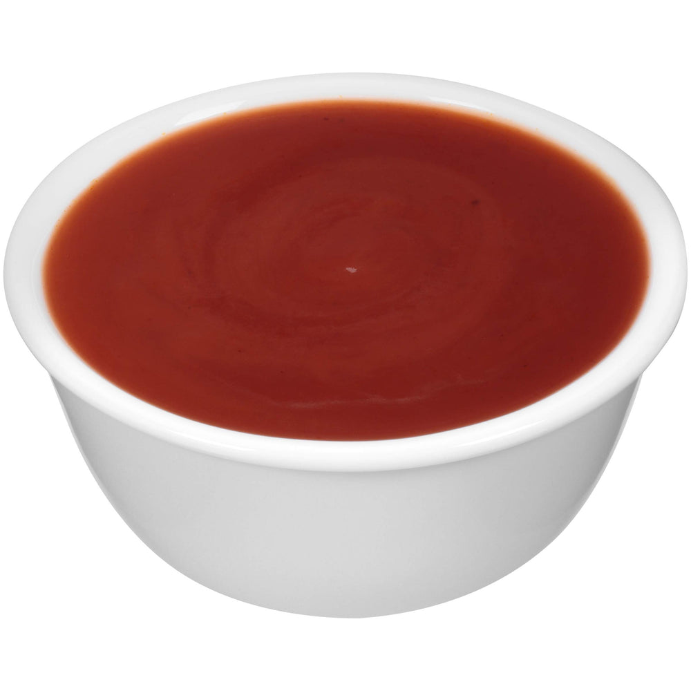 Open Pit sauce in use brushed on ribs during grilling for flavorful finish