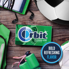 Hand holding Orbit pack illustrating compact size and travel convenience