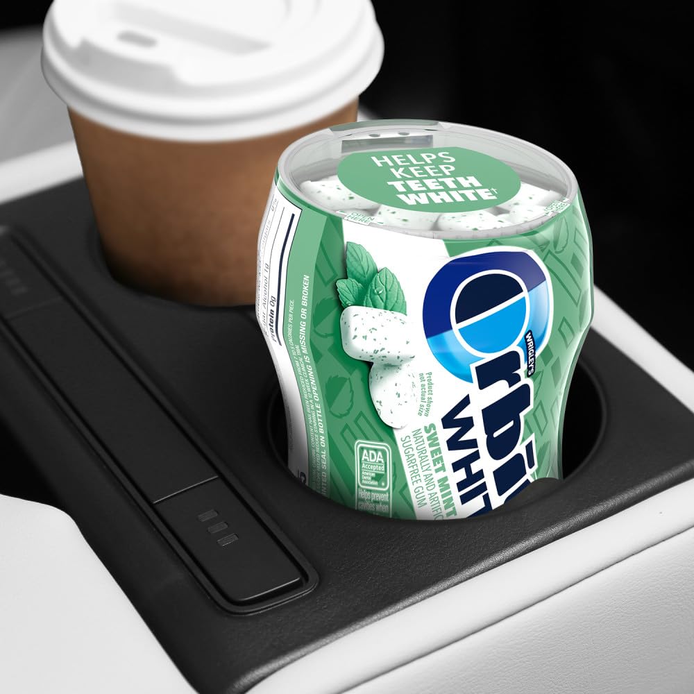 Orbit sweet mint bottle in hand showing product scale and convenient portability