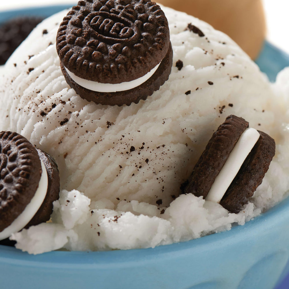 OREO mini cookie held in hand showing bite-size portion