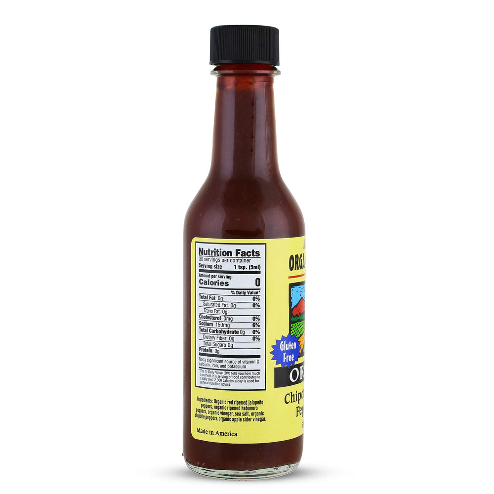 Organic Harvest chipotle-habanero sauce pouring onto grilled dish for smoky savory boost