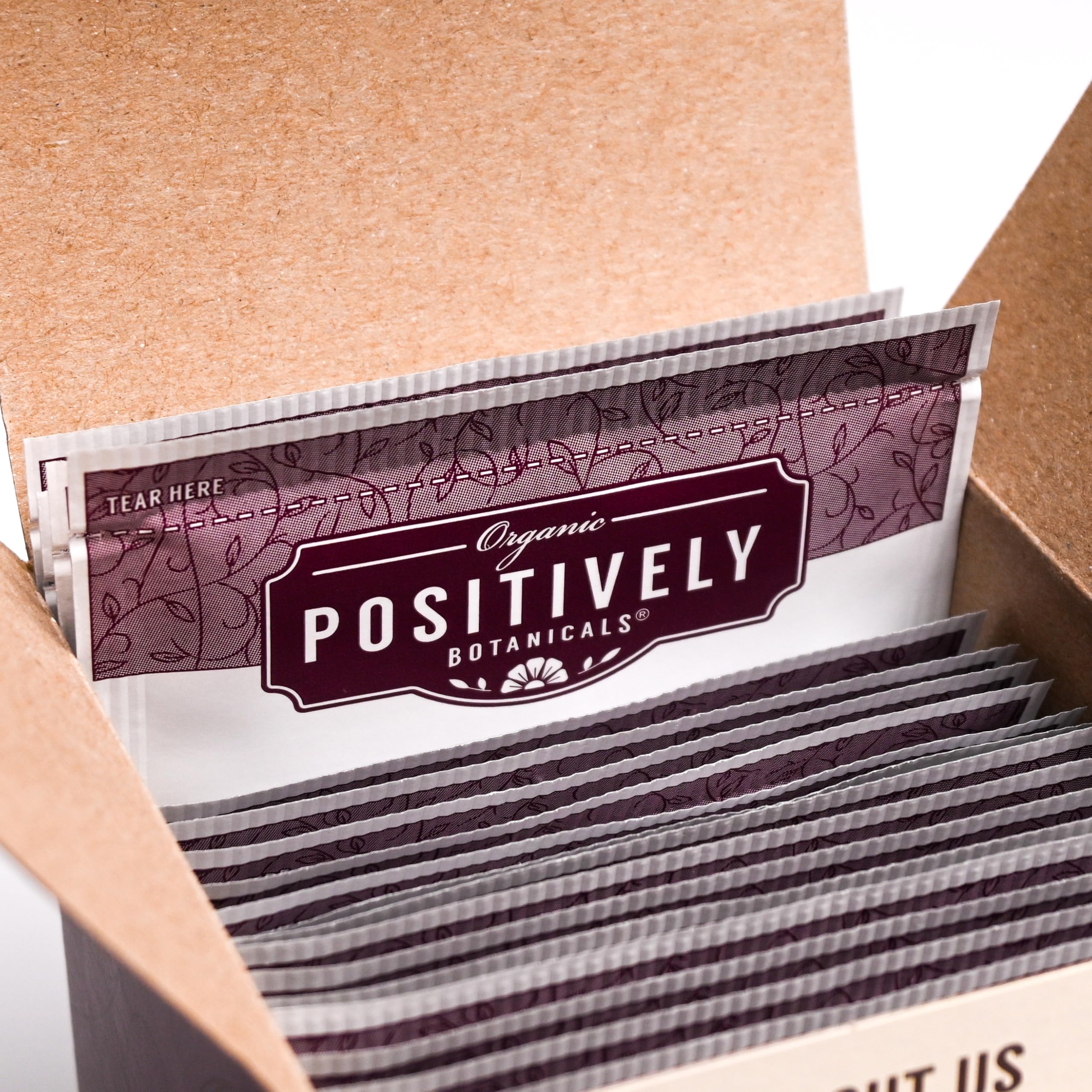 Organic Positively box next to a ruler showing 20-count size and portion scale
