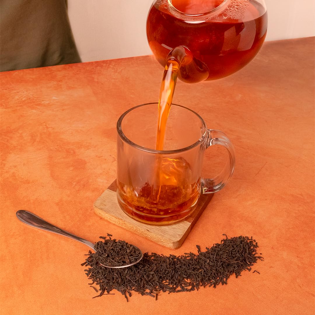 Organic Positively Tea Company 4 ounce pouch next to coin for size and serving comparison