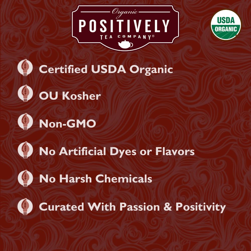 Organic Positively Tea brewed cup with amber-red color and comforting warmth