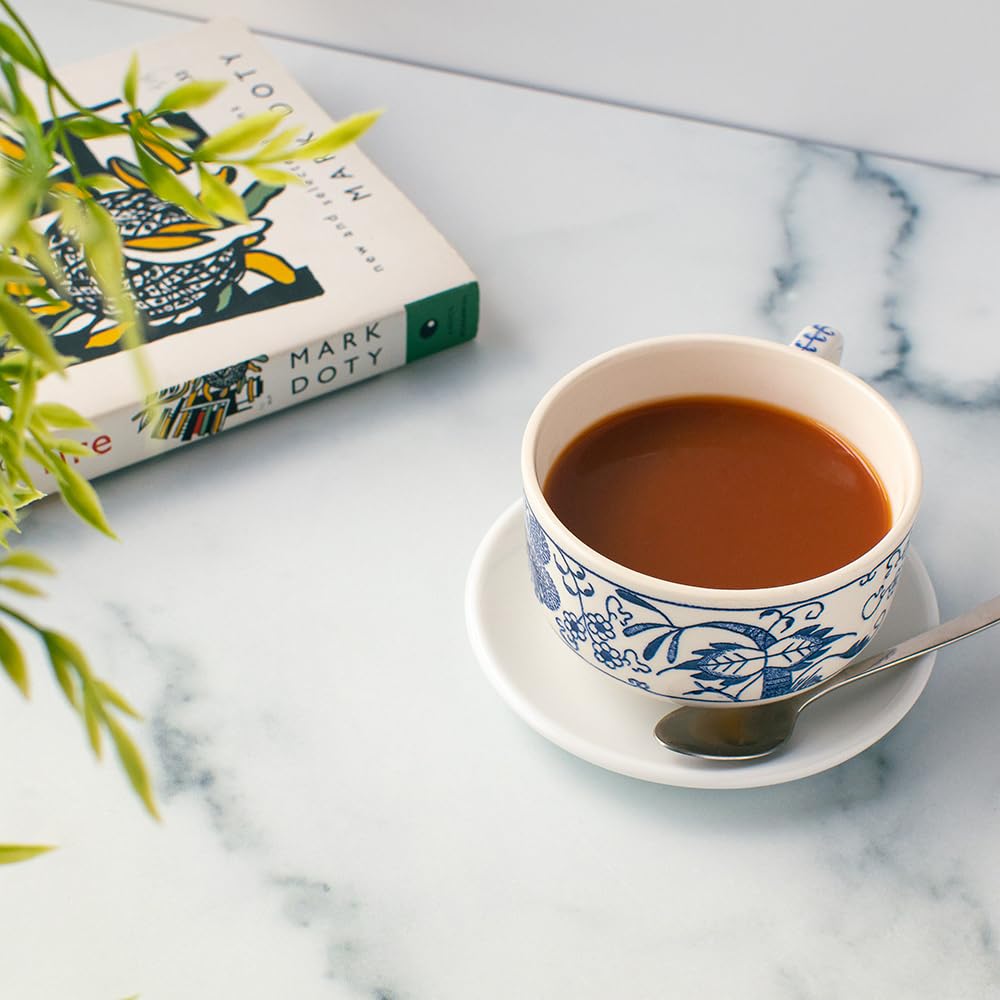 Morning table scene with mug and box highlighting Organic Positively Tea Company everyday enjoyment