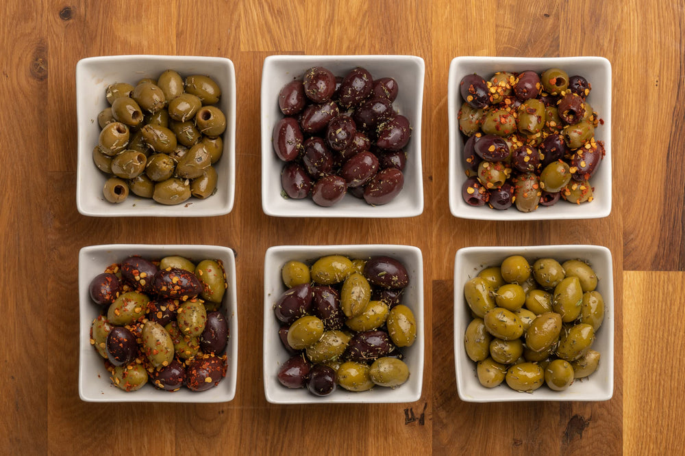 ORIGENES green olives marinated in lemon showing bright, zesty appearance