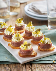 Ortiz anchovies served on crostini adding savory umami to appetizers