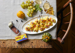 Ortiz anchovies on pizza slice, adds savory umami topping benefit