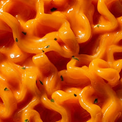OTOKI closeup of saucy wide noodles highlighting chewy texture benefit