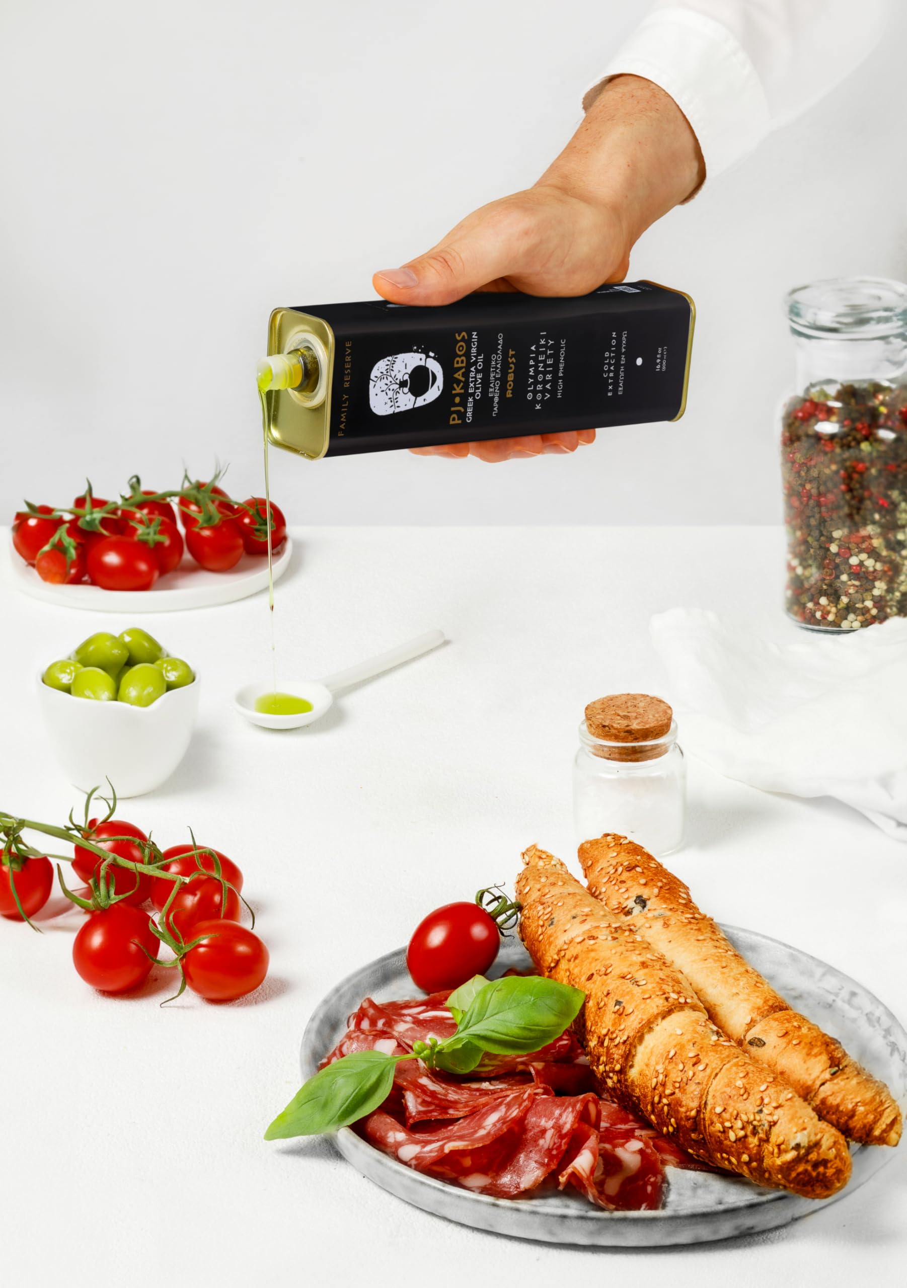 P.J. KABOS 16.9 oz tin held in hand showing size and storage convenience benefit