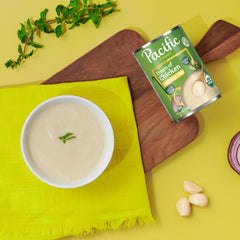 Pacific Foods soup poured into bowl over rice for quick family meal