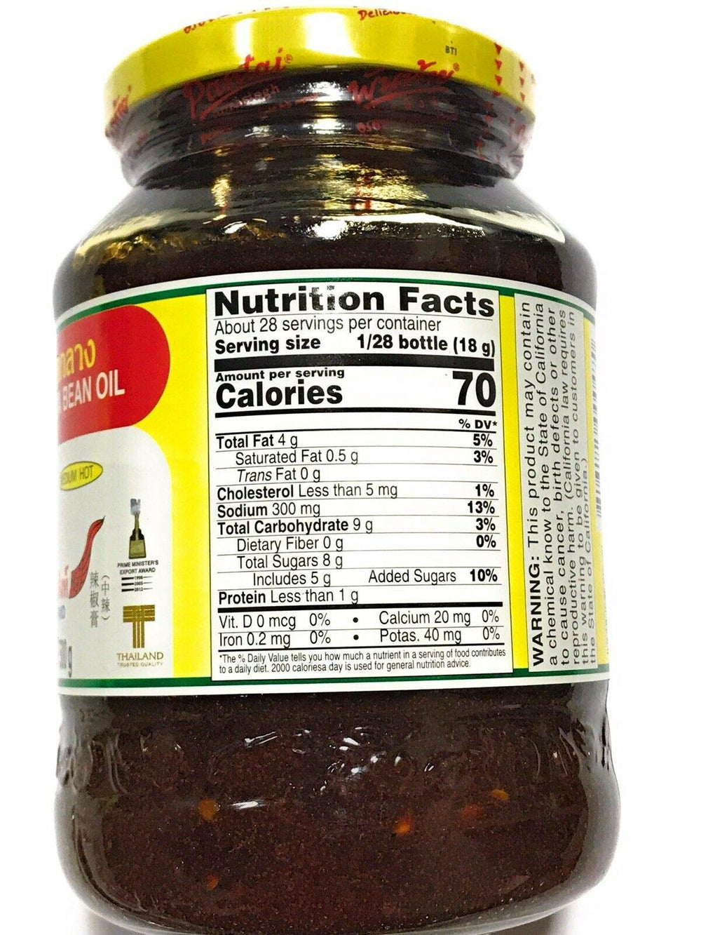 Pantai chili paste on spoon over bowl illustrating glossy texture and easy use