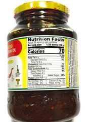 Pantai chili paste on spoon over bowl illustrating glossy texture and easy use