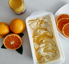 Paradigm Foodworks jar open with spoon demonstrating creamy spreadability benefit