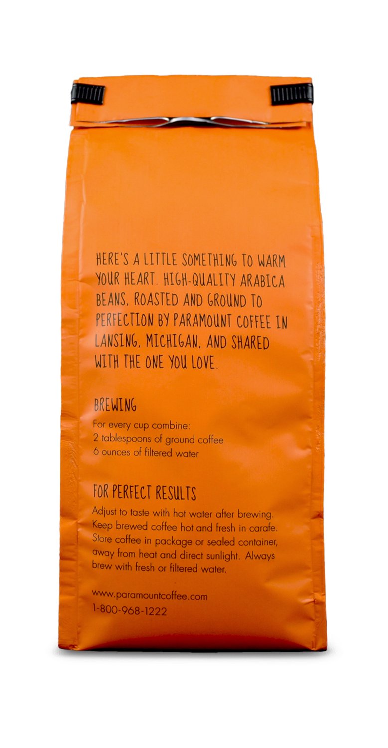 Paramount Roasters ground coffee in wooden scoop showing texture and ready-to-brew convenience