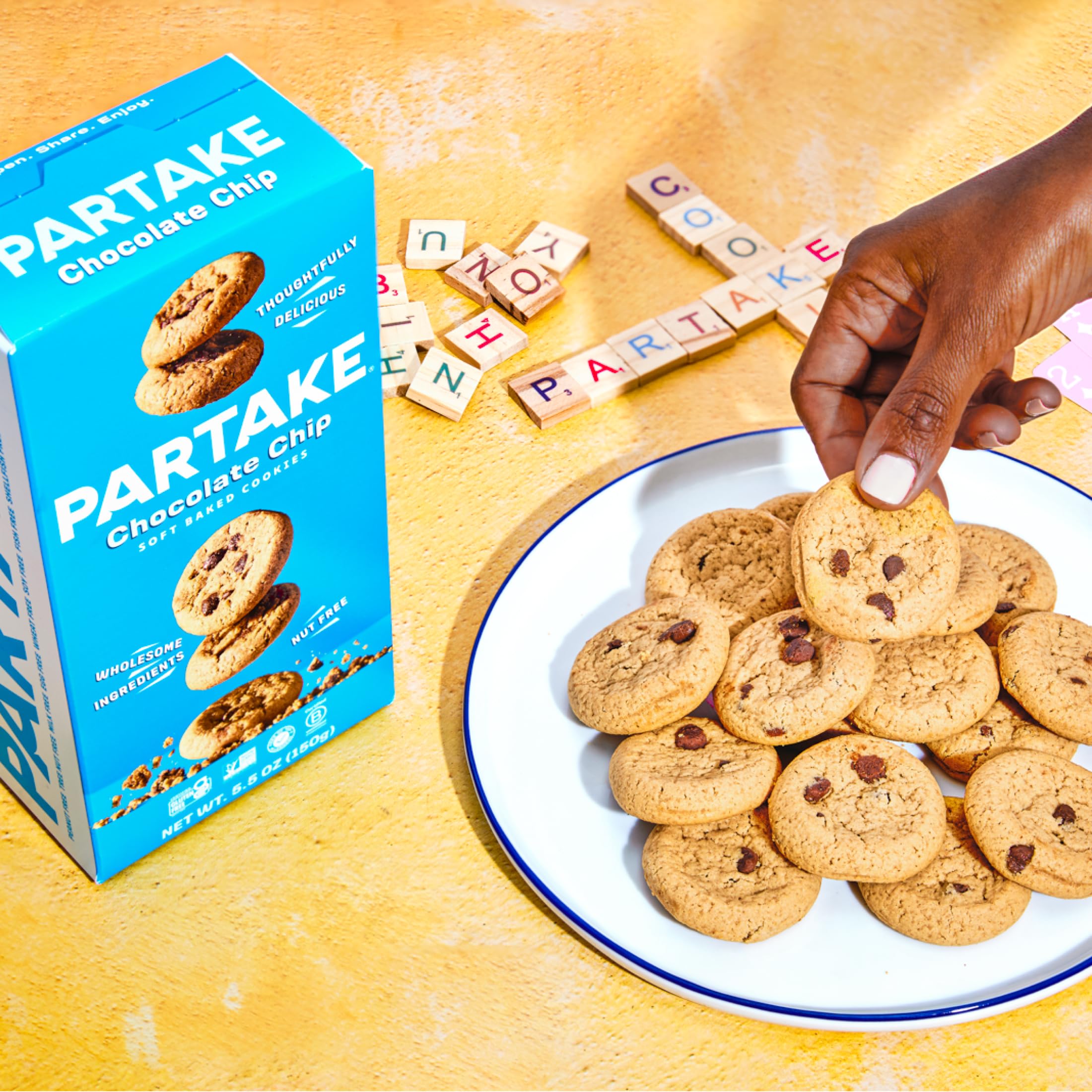 Partake cookie on wooden table lifestyle shot suggesting everyday snack enjoyment