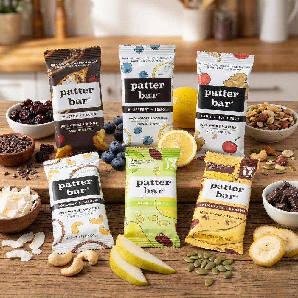 Patter Bar ingredient flatlay with raw nuts and fruit showing ingredient transparency