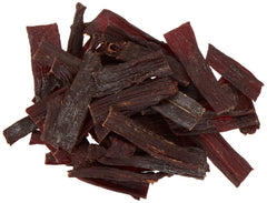 Pawnee Bill's close-up of hickory-smoked jerky pieces highlighting rich texture