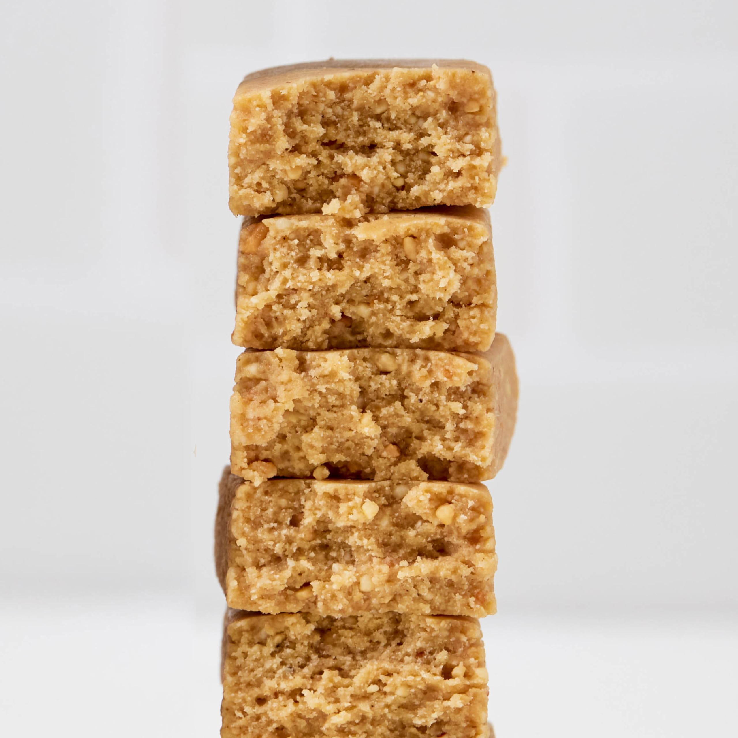 Perfect Bar unwrapped mini peanut butter bar close-up, shows cookie-dough texture