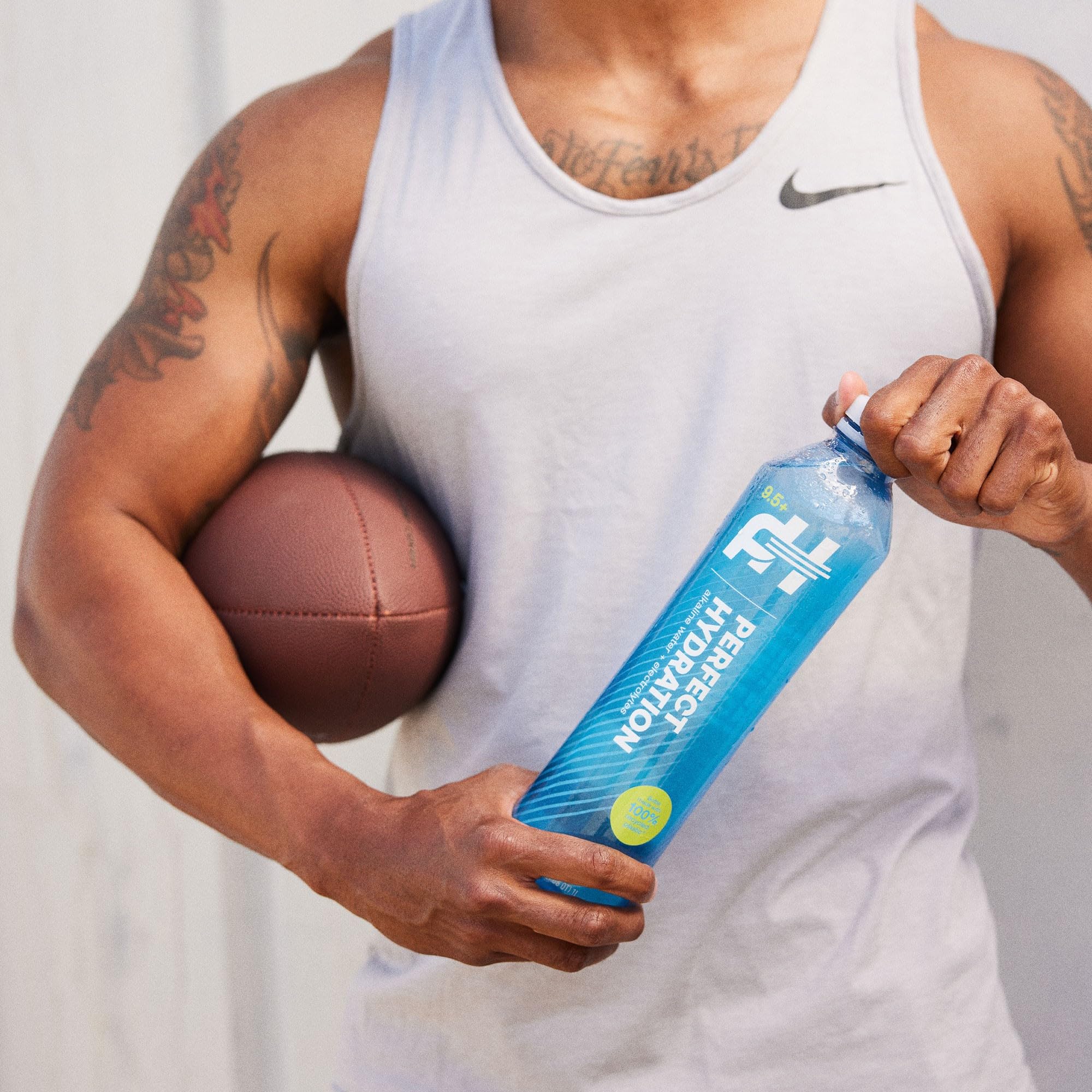 Perfect Hydration bottle outdoors being sipped showing portability and active lifestyle benefit